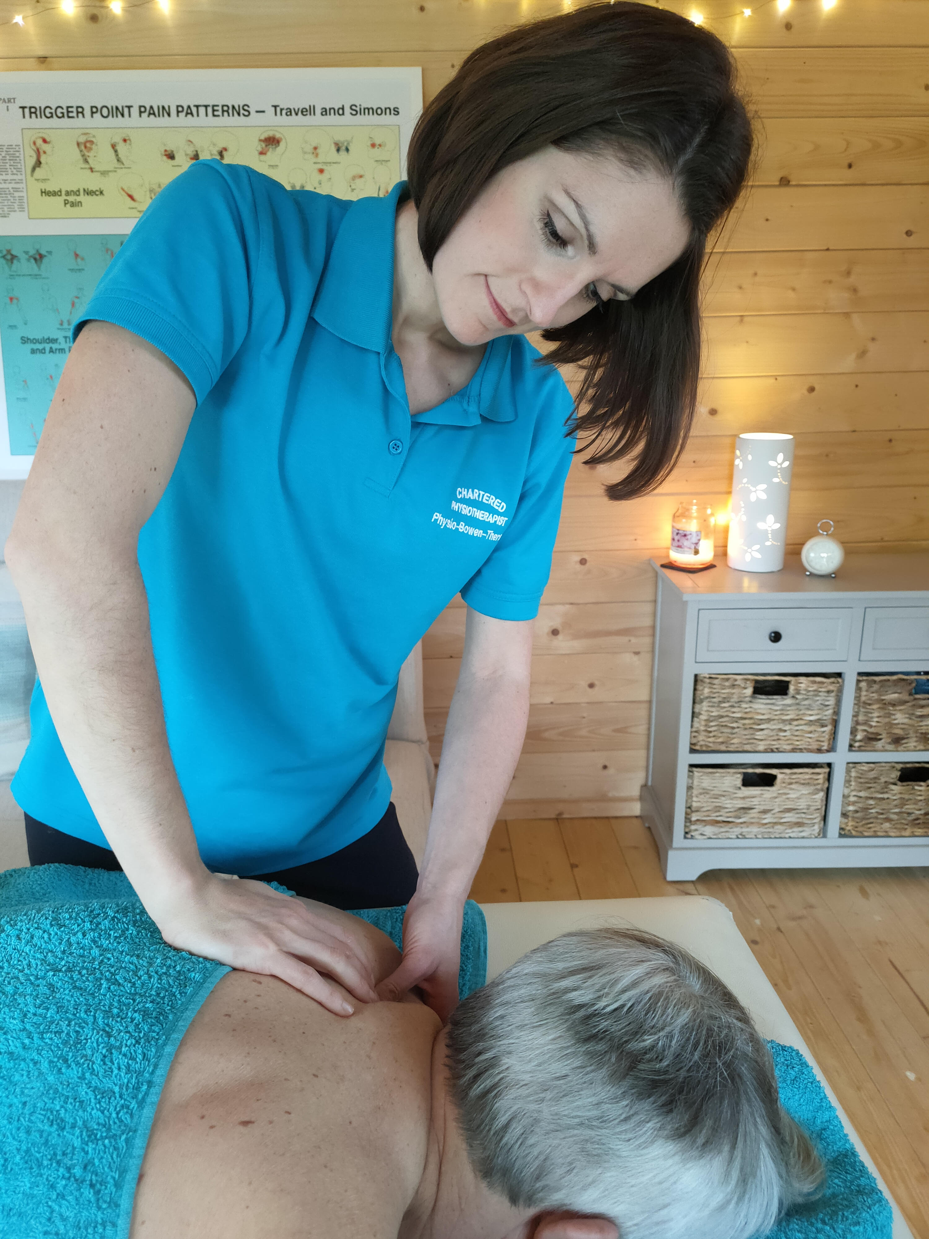 Lauren treating a client's shoulder blade